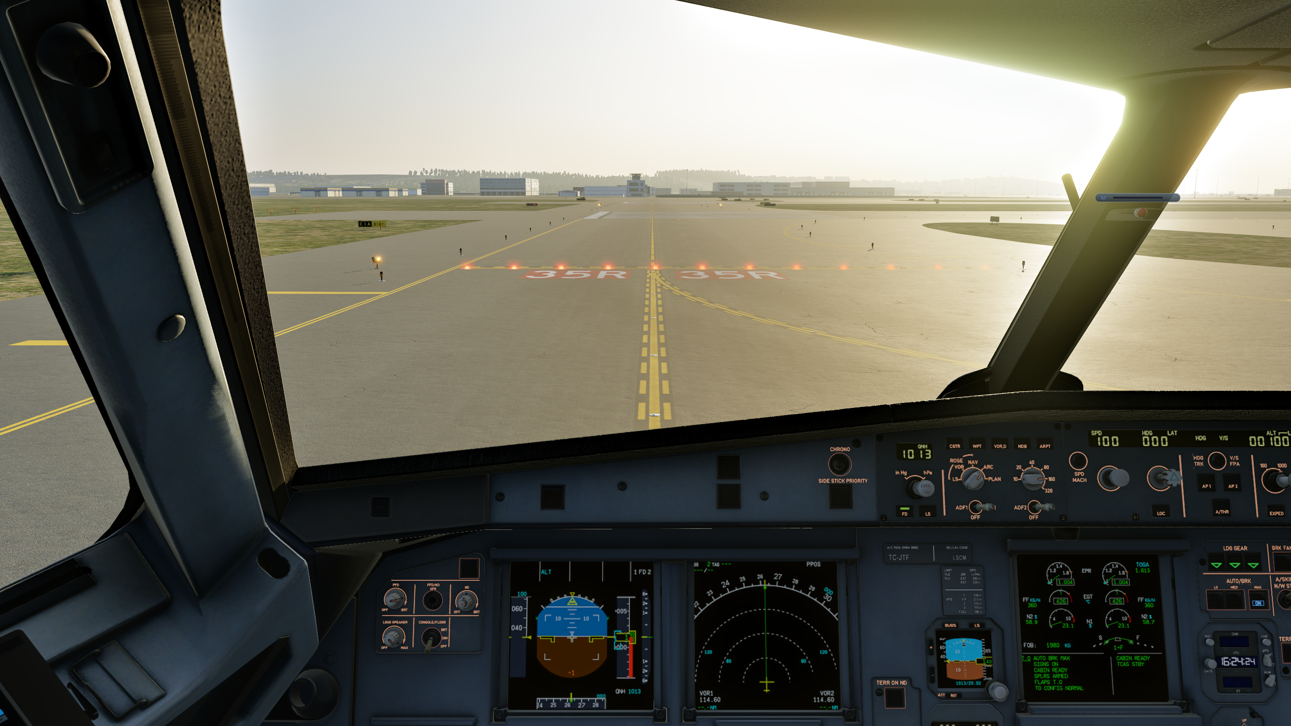 A lit red stop bar at a runway hold-short point — hold short