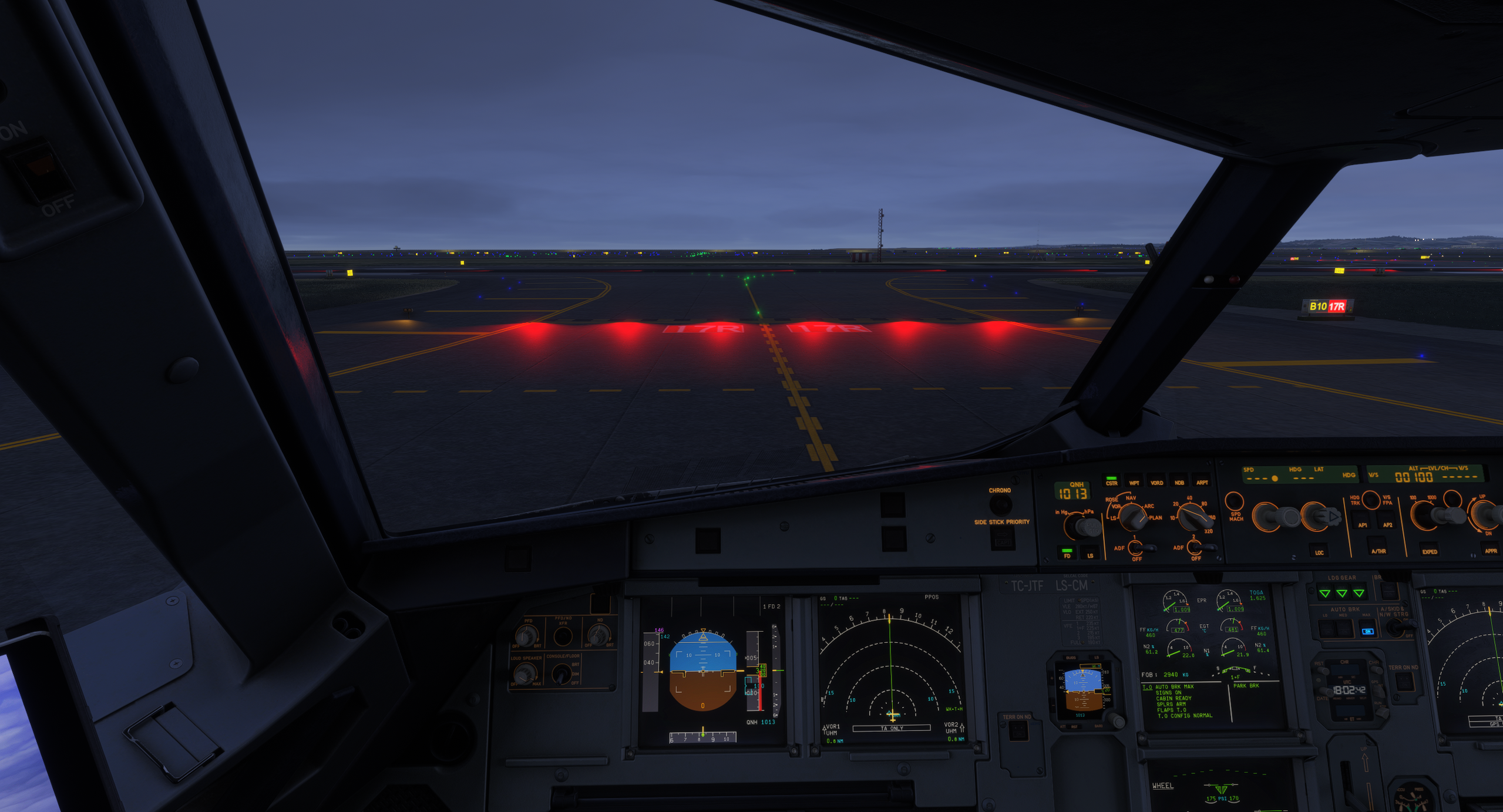 A lit red stop bar at a runway hold-short point — hold short